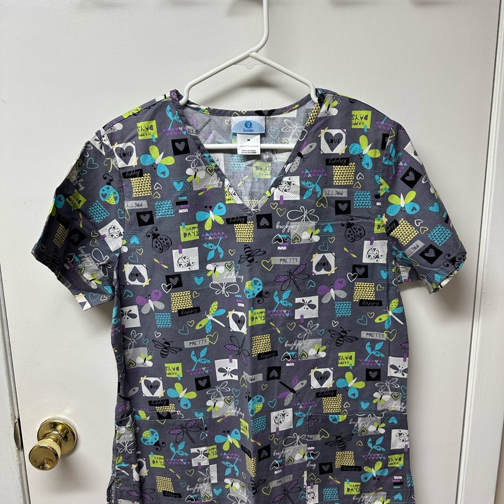 Women’s scrub top, excellent condition.